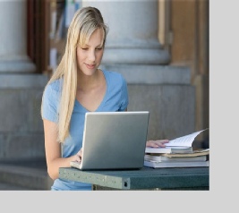 Esencia Girl relaxed with on-line learning Relaxation Training Course - with Computer ready on the desk.
